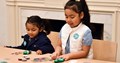 Create and Play program featuring two young girls making crafts
