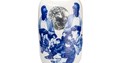 White ceramic vase with blue and black images overlaid; images feature the moon, historic images of Black lived experience, and more